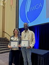 A picture of Carolyn Wisnewski and Antonio Hamilton holding their awards.